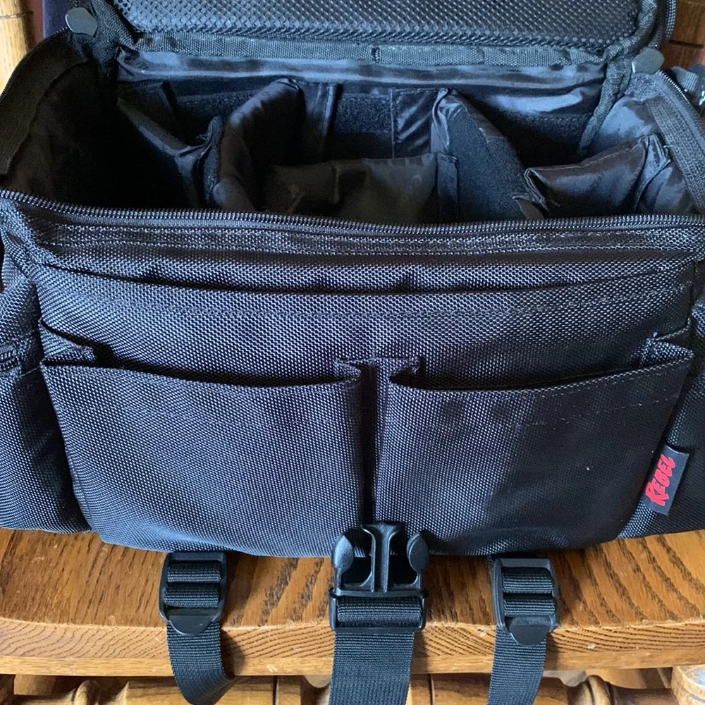 Canon camera bag with many pockets, zippers, straps, 5 inside compartments. EUC